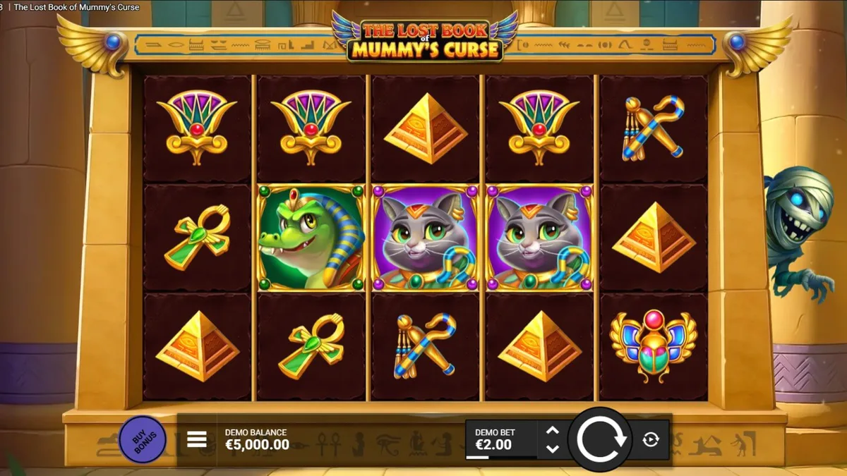 Tampilan visual slot The Lost Book of Mummy’s Curse dengan tema Mesir kartun